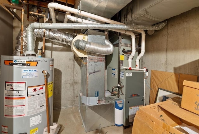 utility room featuring gas water heater