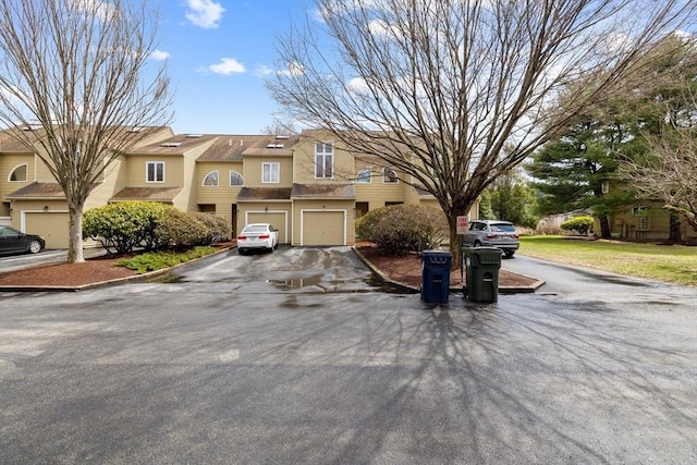 view of front of home with driveway and an attached garage