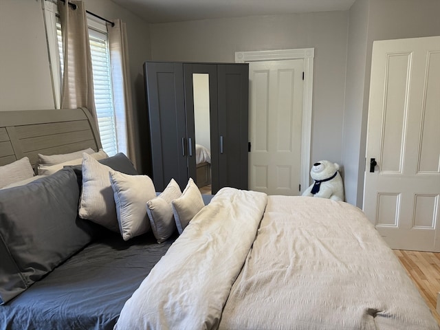 bedroom featuring wood-type flooring