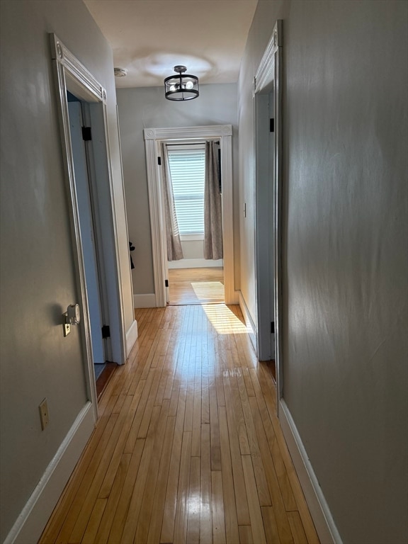 hallway featuring light wood-type flooring