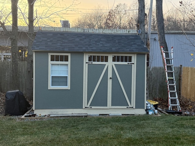 outdoor structure at dusk with a lawn