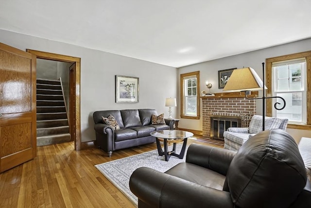 247 S St, Wrentham, MA 02093 - living area featuring wood-type flooring, a fireplace, and stairs