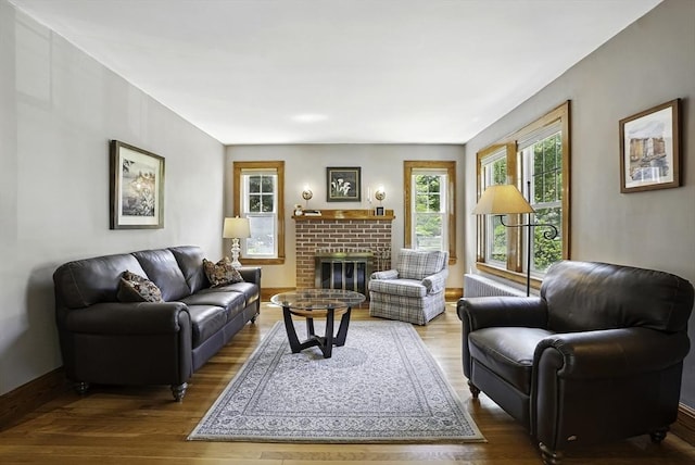 247 S St, Wrentham, MA 02093 - living area featuring wood finished floors, a fireplace, and baseboards