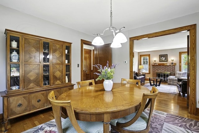 247 S St, Wrentham, MA 02093 - dining space featuring dark wood finished floors and a fireplace