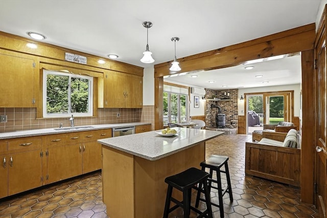 247 S St, Wrentham, MA 02093 - kitchen with a sink, open floor plan, a wood stove, light countertops, and stainless steel dishwasher