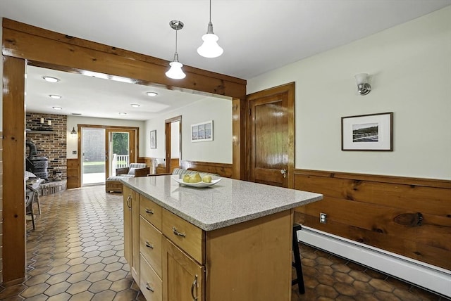 247 S St, Wrentham, MA 02093 - kitchen with baseboard heating, a wainscoted wall, open floor plan, a kitchen island, and hanging light fixtures