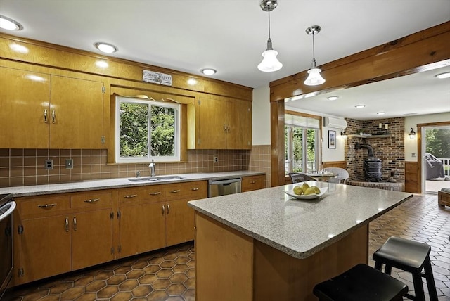 247 S St, Wrentham, MA 02093 - kitchen with a sink, a wood stove, a wall unit AC, a breakfast bar area, and brown cabinets