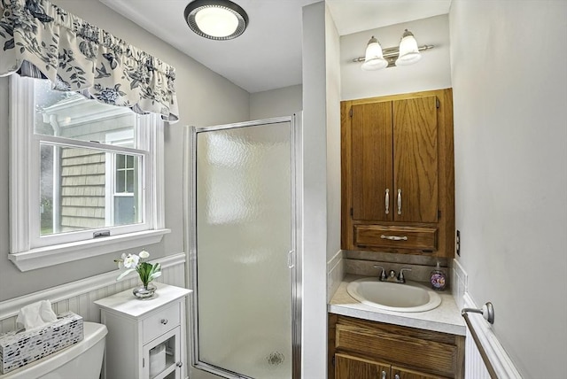 247 S St, Wrentham, MA 02093 - bathroom with a shower stall, toilet, vanity, and a wainscoted wall