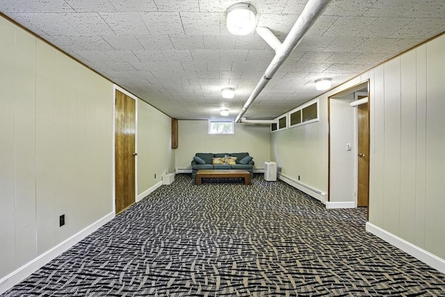 247 S St, Wrentham, MA 02093 - below grade area with a baseboard heating unit, carpet flooring, baseboards, and wooden walls