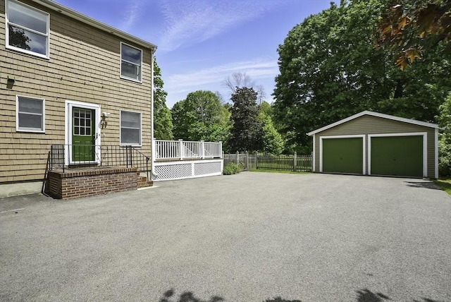 247 S St, Wrentham, MA 02093 - view of patio featuring a detached garage and an outbuilding