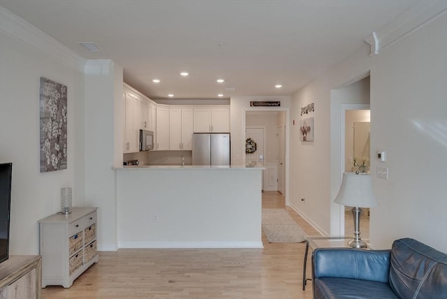 6 Overlook Dr Unit 207, Andover, MA 01810 - kitchen featuring freestanding refrigerator, white cabinets, light wood finished floors, and recessed lighting