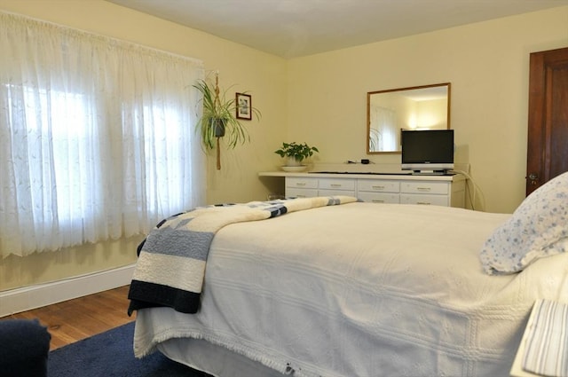 bedroom with wood-type flooring