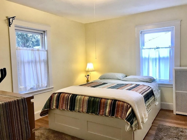 bedroom with wood-type flooring