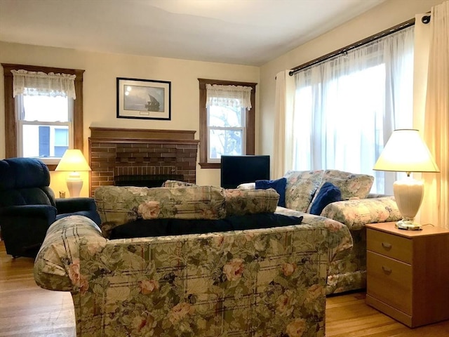 sitting room with light hardwood / wood-style floors and a fireplace