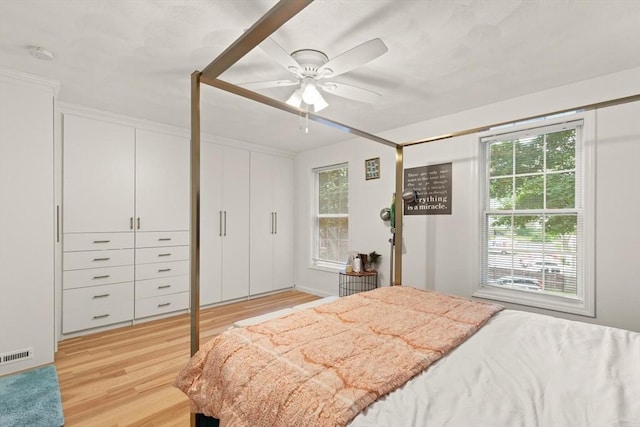 15 N St Unit 2, Haverhill, MA 01830 - bedroom with light wood-style floors and ceiling fan