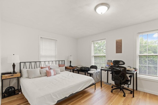 15 N St Unit 2, Haverhill, MA 01830 - bedroom with an office area and light wood-style flooring