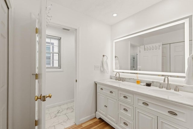 15 N St Unit 2, Haverhill, MA 01830 - bathroom with double vanity and marble finish flooring