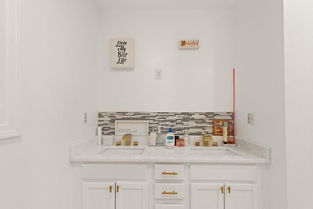 15 N St Unit 2, Haverhill, MA 01830 - kitchen with white cabinetry, light countertops, and backsplash