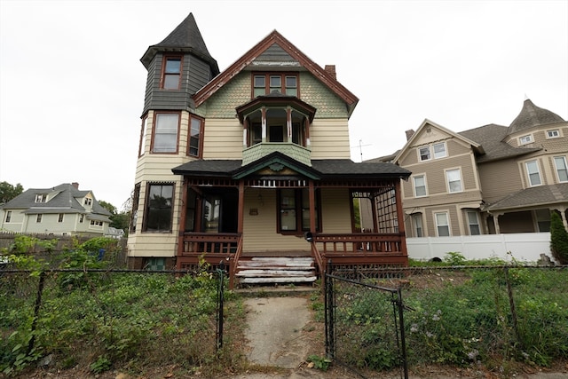 victorian house featuring a porch