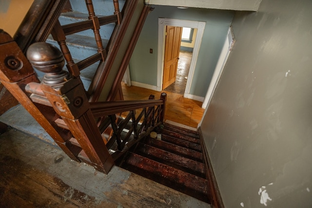 stairs featuring wood-type flooring