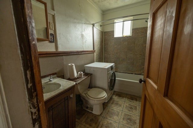 full bathroom with washer / dryer, vanity, tiled shower / bath, ornamental molding, and toilet