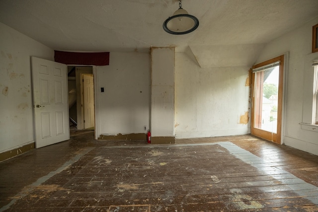 empty room with vaulted ceiling