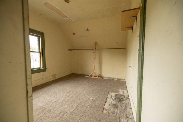 empty room with lofted ceiling