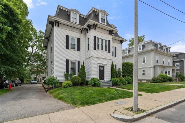 15 Beale St Unit 6, Boston, MA 02124 - second empire-style home with mansard roof, a front lawn, and roof with shingles