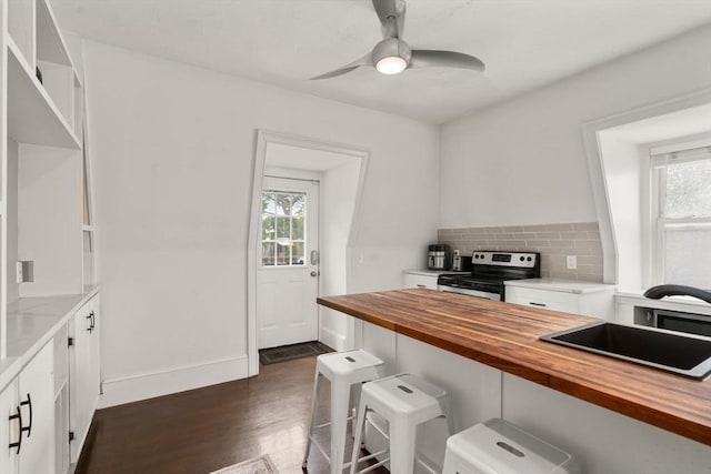 15 Beale St Unit 6, Boston, MA 02124 - kitchen with wood counters, electric stove, a sink, white cabinetry, and dark wood-style flooring
