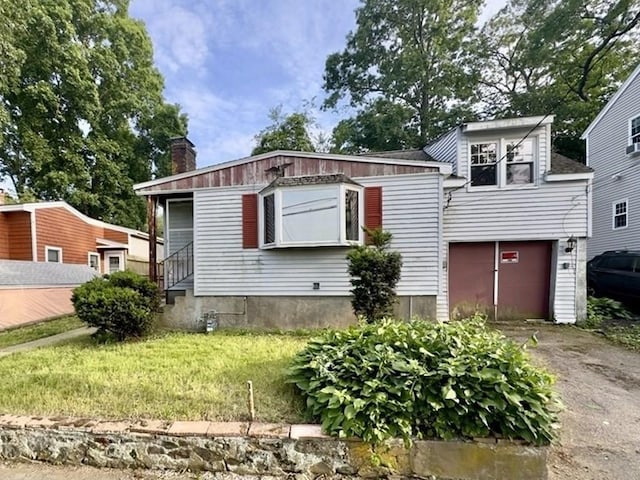 53 Morningside Path, Weymouth, MA 02189 - view of front facade with driveway, a garage, a chimney, and a front lawn