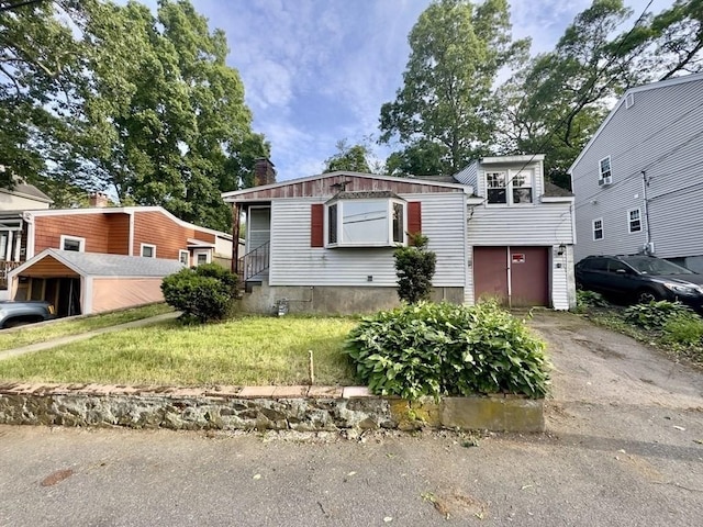 53 Morningside Path, Weymouth, MA 02189 - view of front facade with a garage, driveway, and a chimney