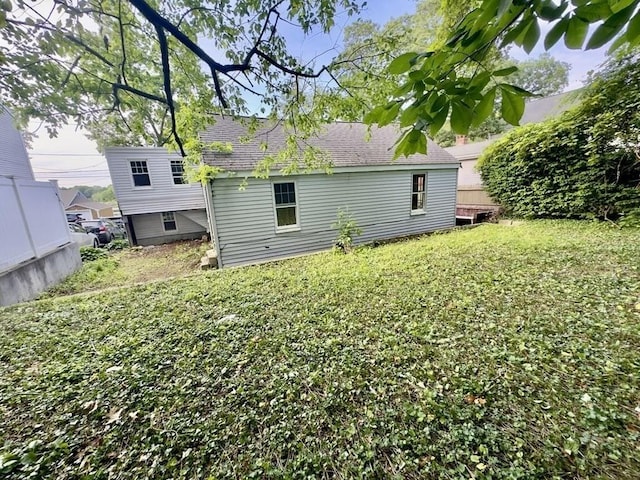 53 Morningside Path, Weymouth, MA 02189 - back of house with roof with shingles and a yard