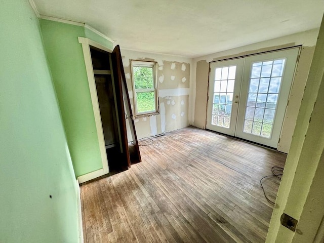 53 Morningside Path, Weymouth, MA 02189 - unfurnished bedroom featuring french doors, multiple windows, access to exterior, and hardwood / wood-style flooring