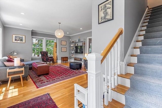 21 Hale St Unit 21, Newton, MA 02464 - living room with wood finished floors, crown molding, stairs, and recessed lighting