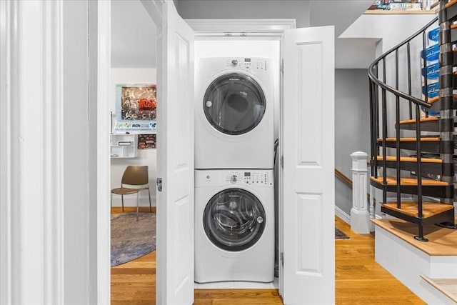 21 Hale St Unit 21, Newton, MA 02464 - laundry room with stacked washing machine and dryer and wood finished floors