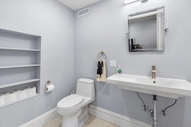 21 Hale St Unit 21, Newton, MA 02464 - half bathroom with toilet and tile patterned flooring