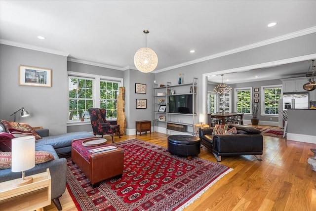 21 Hale St Unit 21, Newton, MA 02464 - living room with light wood-style flooring, recessed lighting, a chandelier, and ornamental molding