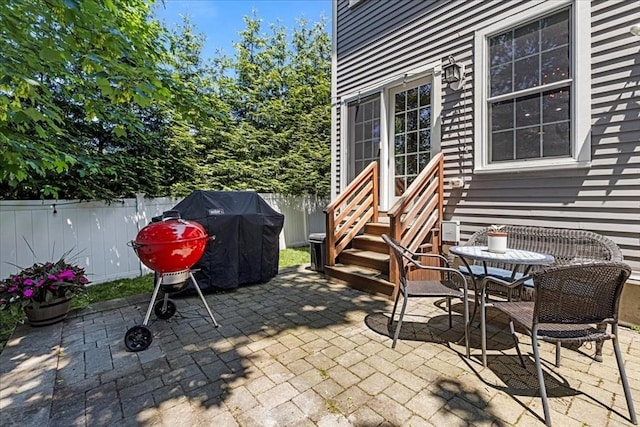 21 Hale St Unit 21, Newton, MA 02464 - fenced backyard with entry steps, a patio, and area for grilling
