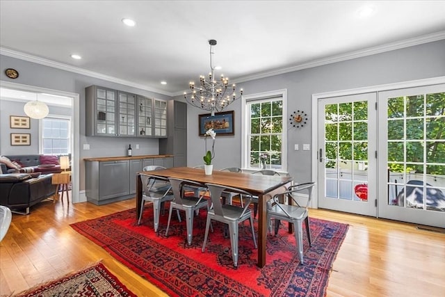 21 Hale St Unit 21, Newton, MA 02464 - dining space featuring a chandelier, ornamental molding, light wood-style flooring, and recessed lighting