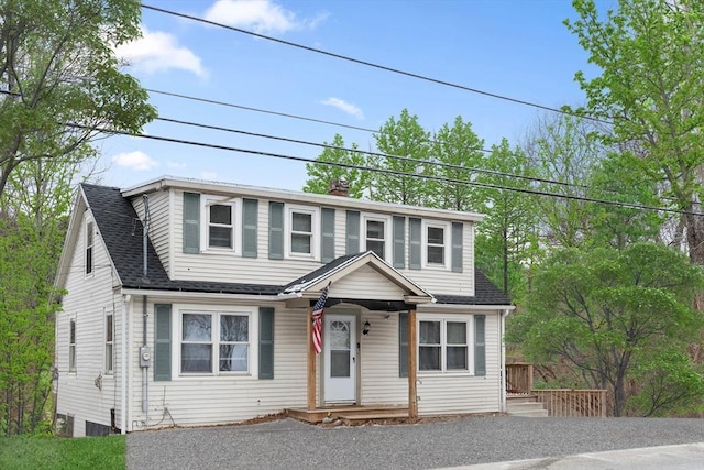 view of front of house featuring a shingled roof