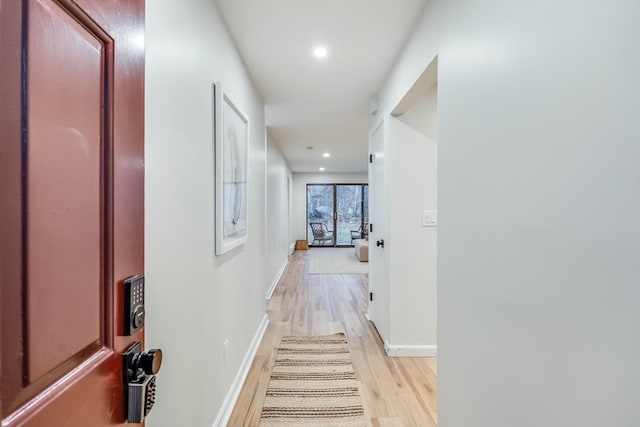 hall with light hardwood / wood-style floors