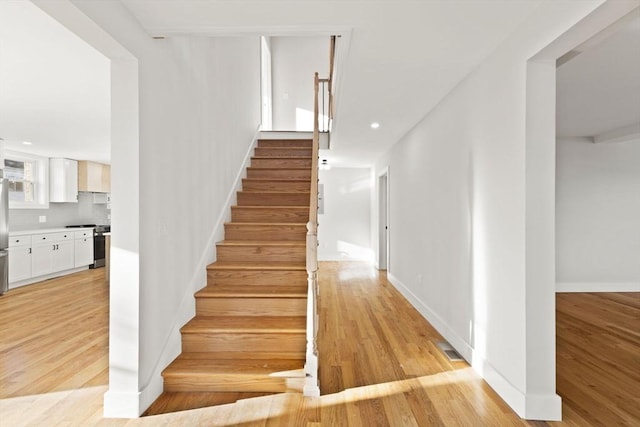 stairway with wood-type flooring