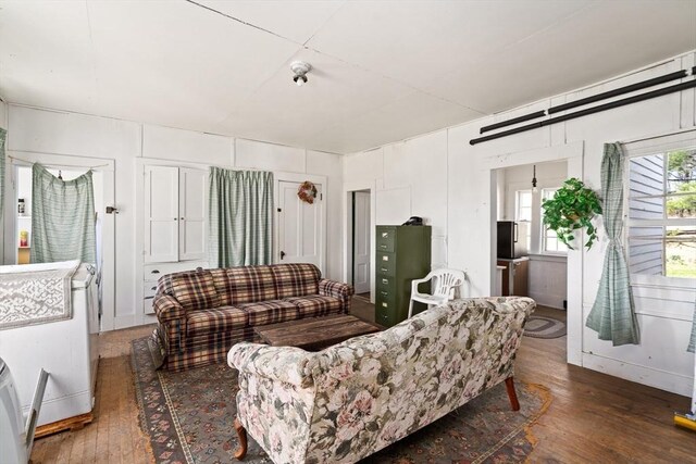 living area with hardwood / wood-style floors