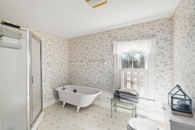 full bathroom with tile patterned floors, a shower stall, wallpapered walls, and a freestanding tub