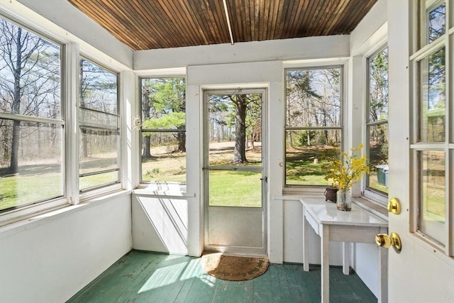unfurnished sunroom with a wealth of natural light