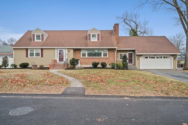 new england style home featuring a garage