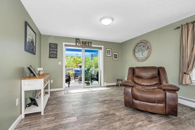 37 Sylvan Rd, Gardner, MA 01440 - living area featuring baseboards, baseboard heating, and wood finished floors