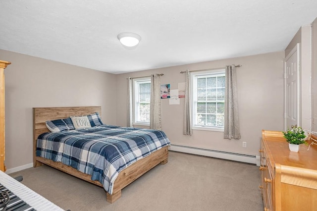 37 Sylvan Rd, Gardner, MA 01440 - bedroom featuring baseboard heating, light colored carpet, and baseboards