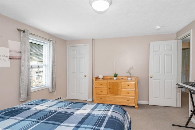 37 Sylvan Rd, Gardner, MA 01440 - carpeted bedroom with baseboards and a baseboard heating unit