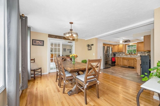 37 Sylvan Rd, Gardner, MA 01440 - dining room featuring light wood finished floors, a chandelier, and baseboards